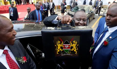 Thomas Mukoya / Reuters Kenya's Finance Minister Henry Rotich holds up a briefcase