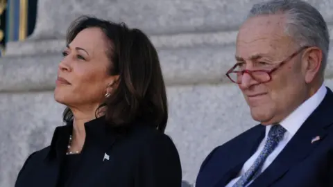 Getty Images US Vice President Kamala Harris and US Senate Majority Leader Chuck Schumer (D-NY) attend the funeral service for the late US Senator Dianne Feinstein