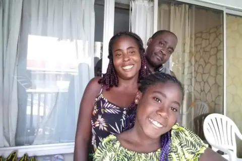 Family Karl Henry and Rebecca Solomon-Henry with daughter Janayah