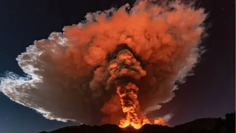 Etna has sent up magnificent plumes of orange smoke