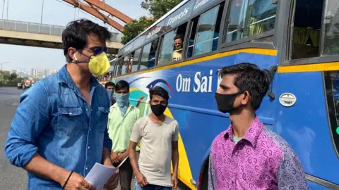 Sonu Sood Sonu Sood with migrant workers