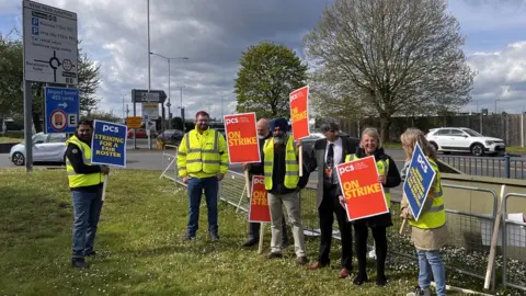 PA Media Members of the Public and Commercial Services Union on the picket line at Heathrow Airport