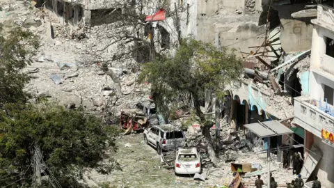 Reuters destroyed buildings and army soldiers