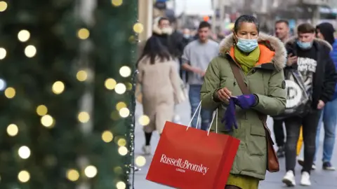 PA Media A woman shopping on Buchanan Street in Glasgow