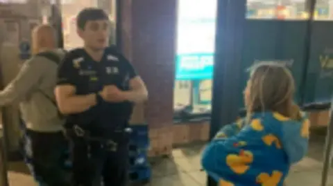 Family handout A police officer confronts a girl riding an e-scooter