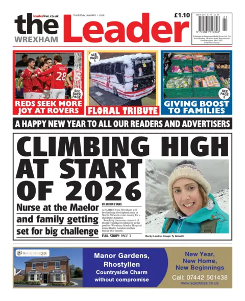 The Wrexham Leader Front page of the Wrexham Leader. Main headline reads: 'Climbing high at start of 2026'. Sub headline reads: 'nurse at the Maelor and family getting set for big challenge' alongside a photograph of a nurse pictured among snowy mountains. Other headlines read: 'Reds seek more joy at rovers' and 'giving boost to families'