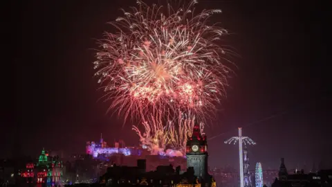 Fireworks in Edinburgh Castle. They are big and red.