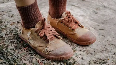 Getty Images Poverty, feet