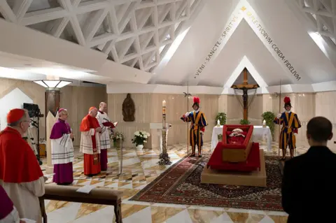 Getty Images Cardinals take part in the rite of certification of death of Pope Francis in the chapel of Casa Santa Marta - 21 April 2025
