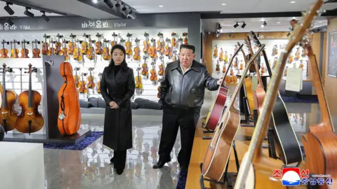 KCNA VIA KNS via Reuters This picture taken on February 16, 2026 and released by North Korea's official Korean Central News Agency (KCNA) on February 17, 2026 shows North Korean leader Kim Jong Un (R) and his daughter Ju Ae (L) inspecting the newly completed street in Hwasong area of Pyongyang. 
