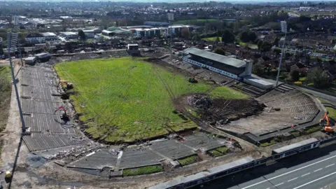 Getty Images Ariel changeable  of a GAA stadium that has fallen into disrepair. Several diggers tin  beryllium  seen moving   connected  the site. In the inheritance  astatine  the apical  of the framework  are different   buildings and houses