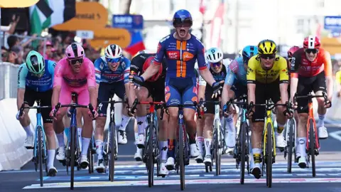 Casper van Uden celebrates as he crosses the line in Lecce