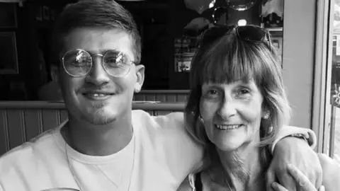 Laurence Denis Black and white picture of Laurence Denis with his arm around his mother Pauline.