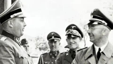 Galerie Bilderwelt/Getty Images Heinrich Himmler (right), a five-star general, during a visit to the Auschwitz camp in Poland, where he inspects the Monowitz-factories. 18th July 1942