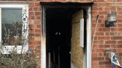 Richard Daniel/BBC Fire damage inside a house