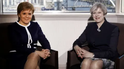 PA Nicola Sturgeon and Theresa May