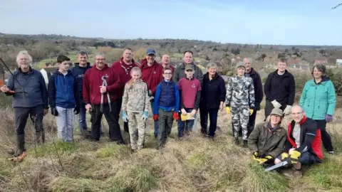 Wiltshire Council A group of people, including children standing outside smiling