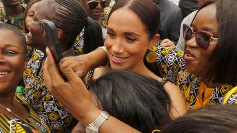 Women taken selfies with the Duchess of Sussex in Abuja, Nigeria - Saturday 11 May 2024