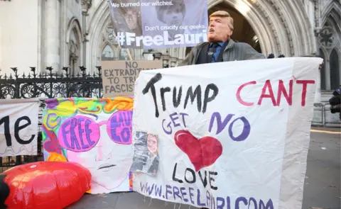 PA Lauri Love supporter and banners outside the High Court in London