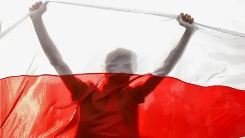 Reuters An opposition supporter at a rally in Minsk