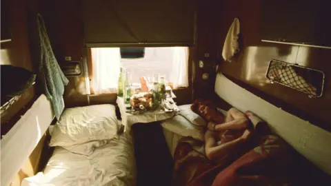 Geoff MacCormack A photo of David Bowie in a caravan