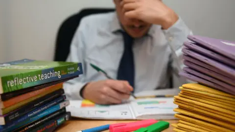 PA teacher marking schoolwork