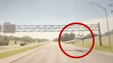 Small plane makes emergency landing on the highway.