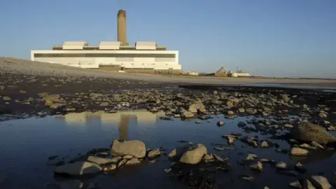 Getty Images The Aberthaw Power Station in the Vale of Glamorgan in the background. There is a puddle in the foreground.