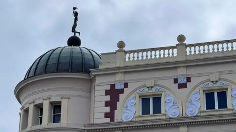 BBC/Aaron Outram The newly installed statue on top of the Lyceum, a traditional proscenium arch theatre