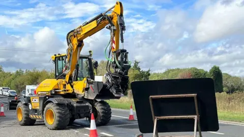 Lincolnshire County Council A big yellow Pothole Pro machine on a Lincolnshire road