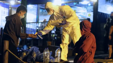 EPA Emergency Services personnel provide medical attention to some of the rescued migrants at sea