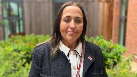 Councillor Jo Monk smiling at the camera.
