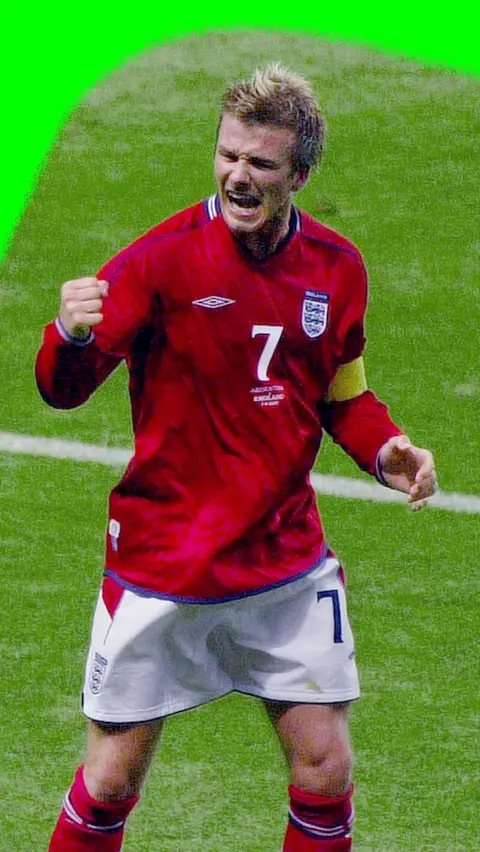 David Beckham fistbumps the air to celebrate scoring for England against Argentina in the 2002 World Cup