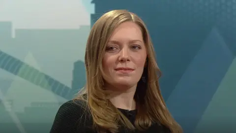 Labour MP Sarah Edwards, a woman with long dark blonde hair, wearing a black top.