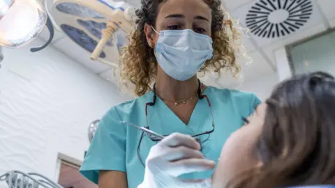 Dentist with patient