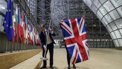 Getty Images The UK flag is removed from the European Council building in Brussels.