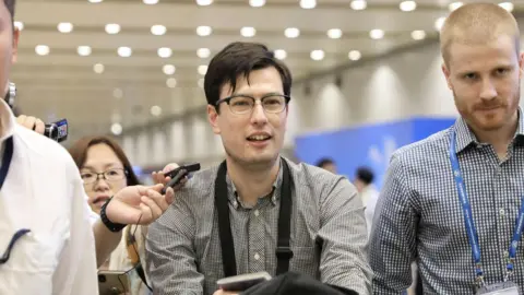 Reuters An Australian student Alek Sigley, 29, who was detained in North Korea, arrives at Beijing international airport in Beijing, China