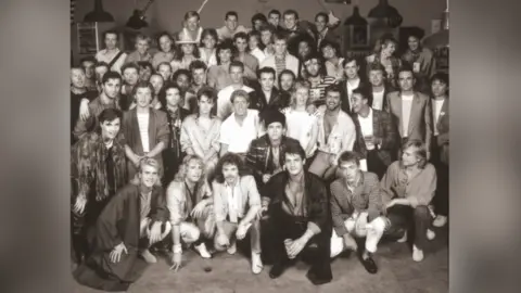 The infamous group image of all the artists who performed at Live Aid in 1985, as captured by celebrity photographer Brian Aris. 