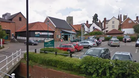Google A Google Streetview image of the outside the Co-op in Framlingham and its car park.