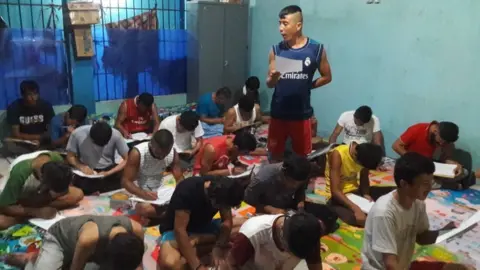 Shams Erfan Shams teaching English at the detention centre