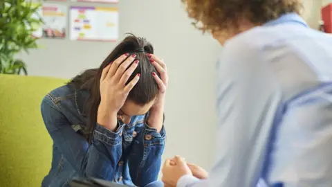 Getty Images A woman in therapy