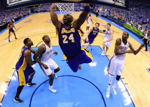 Larry W. Smith / EPA Kobe Bryant dunks the ball against Oklahoma City Thunder in Oklahoma City, 2012.