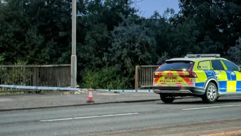 police car by cordon