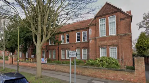 A red brick building, with Georgian-style windows.