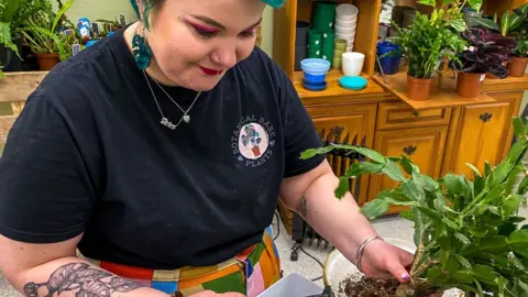 Tesni Boughen holding a plant