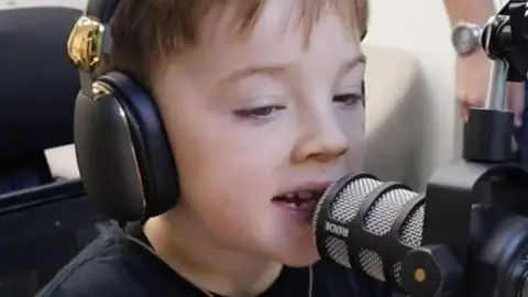 Blackpool Tower Charlie at a microphone during a recording session