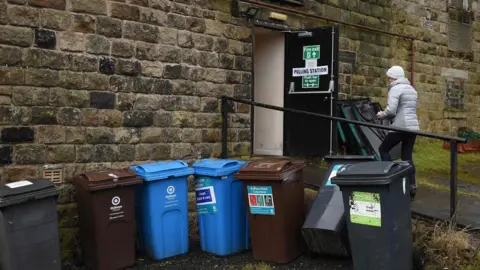 AFP Bins outside a polling station in Diggle, Greater Manchester