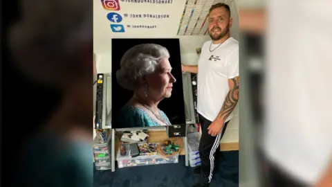 John Donaldson John Donaldson standing next to his portrait of the Queen