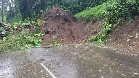 Hawaii Department of Transportation. A landslide blocks a highway on Hawaii's big island.