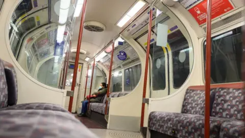 Getty Images Woman alone on train